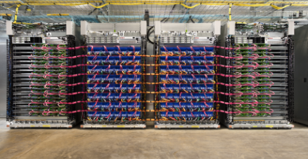 Racks of servers powered by Tensor Processing Units (TPUs), Google's custom processors for machine learning